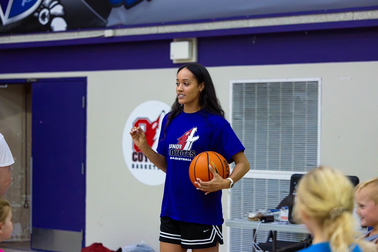 Nayo Raincock-Ekunwe coaching the Junior Coyotes girls group