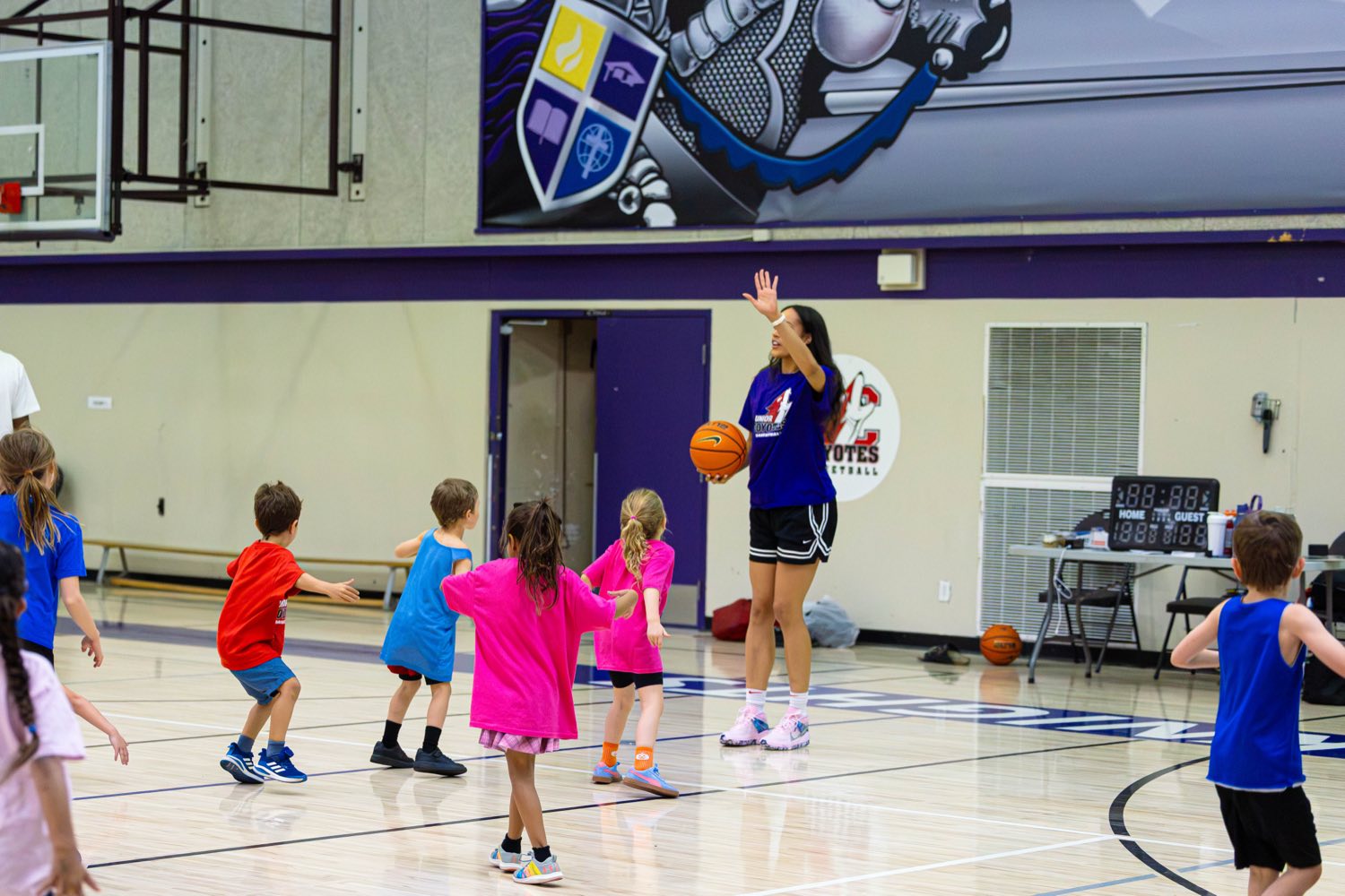 Nayo Raincock-Ekunwe leading the free All Girls Camp
