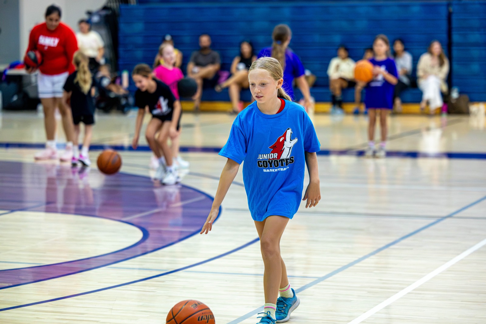 A girl bringing the ball up at the Junior Coyotes free all girls camp